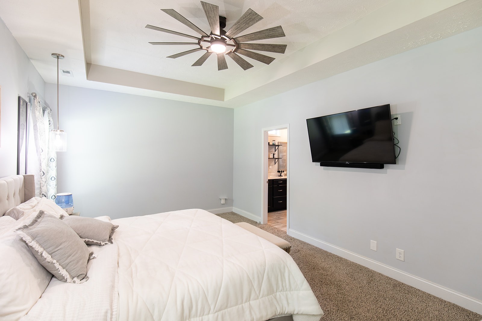 1045 Fuji Lane Clarksville, TN 37040 - Photo 9 of 24 a bedroom with a bed and a flat screen tv