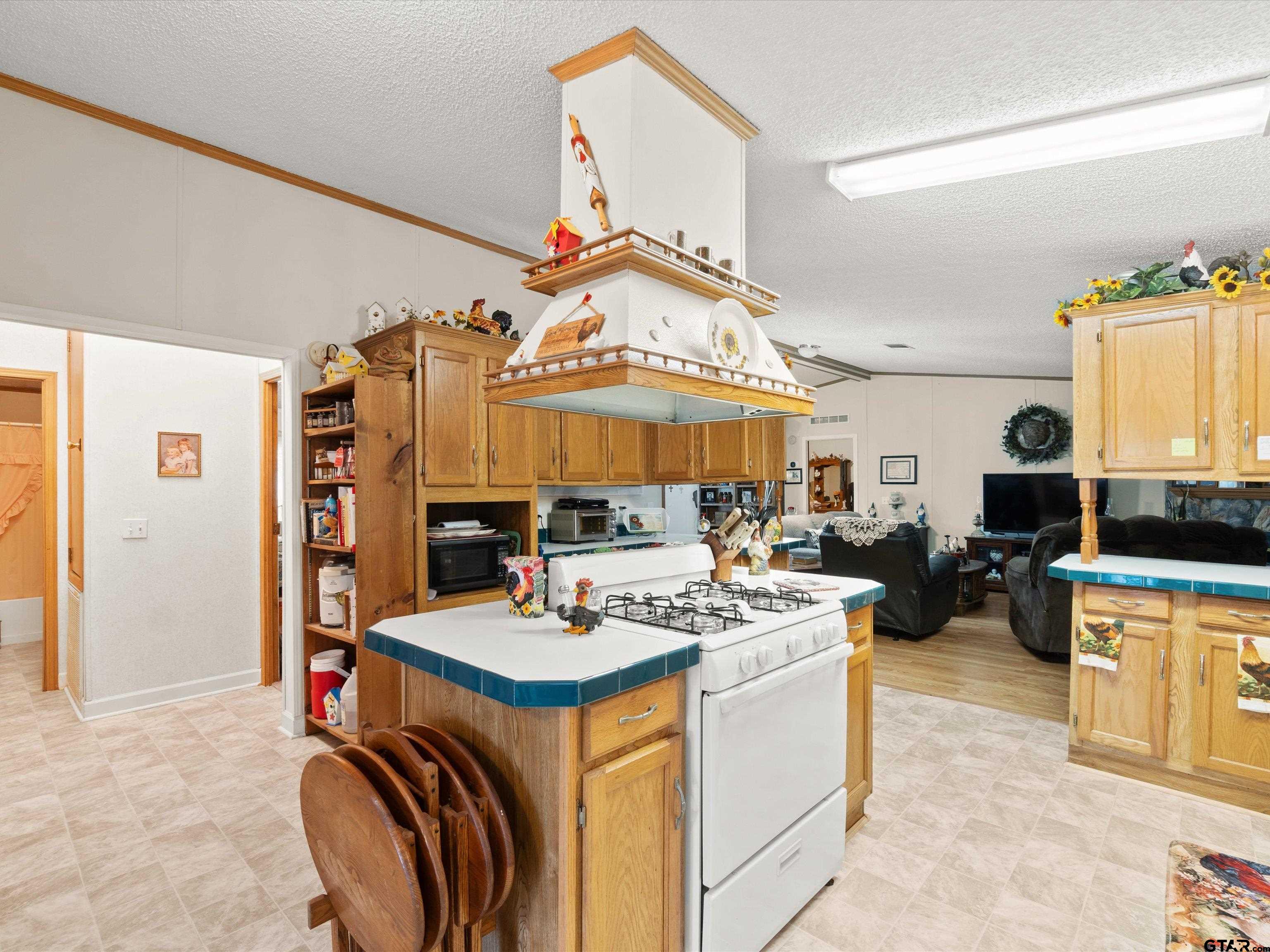 2811 Medlin Road Gilmer, TX 75645 - Photo 19 of 30 a view of kitchen sink and stove