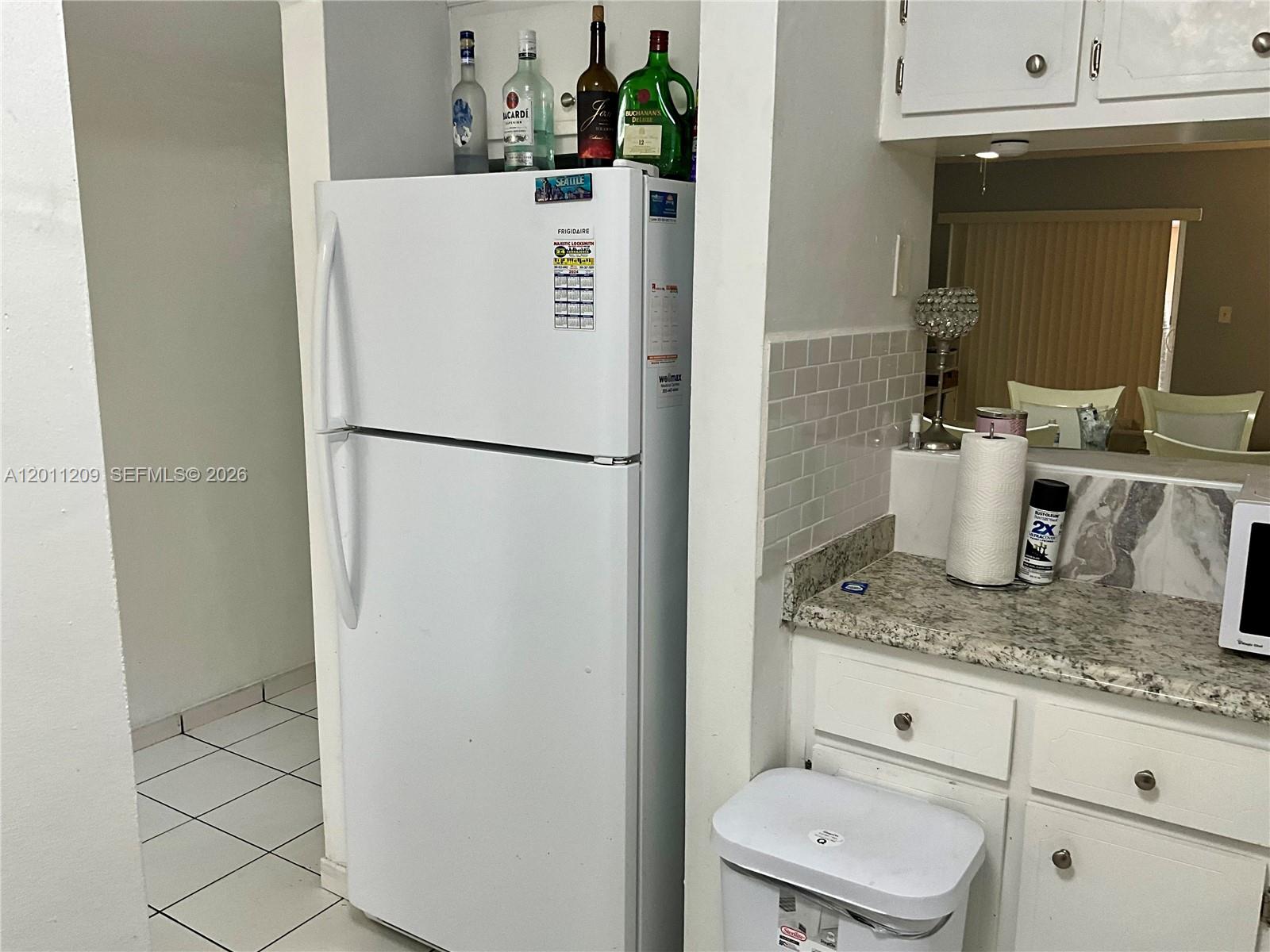 1910 West 56th Street, Unit 3226 Hialeah, FL 33012 - Photo 19 of 21 a white refrigerator freezer sitting inside of a kitchen