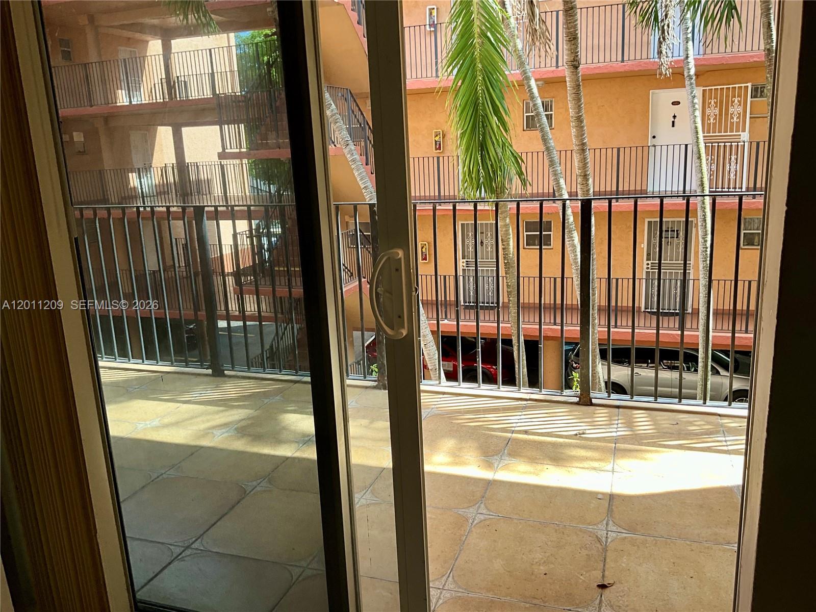 1910 West 56th Street, Unit 3226 Hialeah, FL 33012 - Photo 7 of 21 a view of swimming pool with a yard and lawn chairs