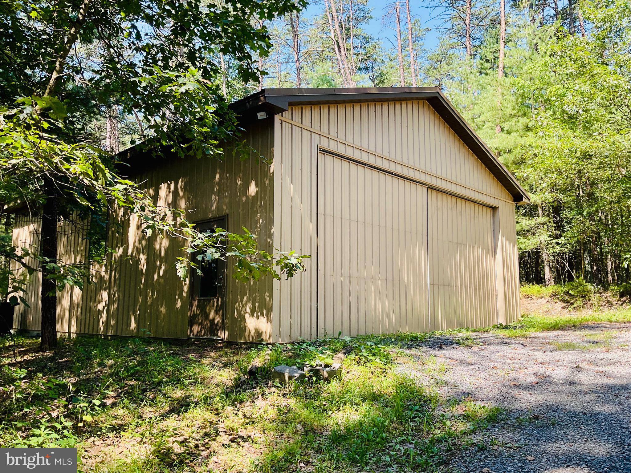 13200 Crossover Road Northeast Flintstone, MD 21530 - Photo 19 of 60 a view of a house with a tree