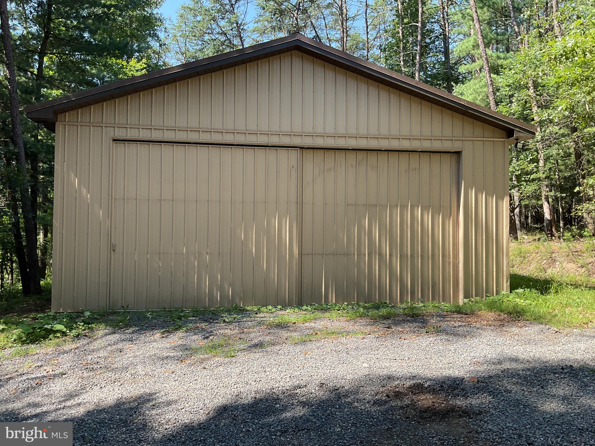13200 Crossover Road Northeast Flintstone, MD 21530 - Photo 20 of 60 a backyard of a house with plants and trees