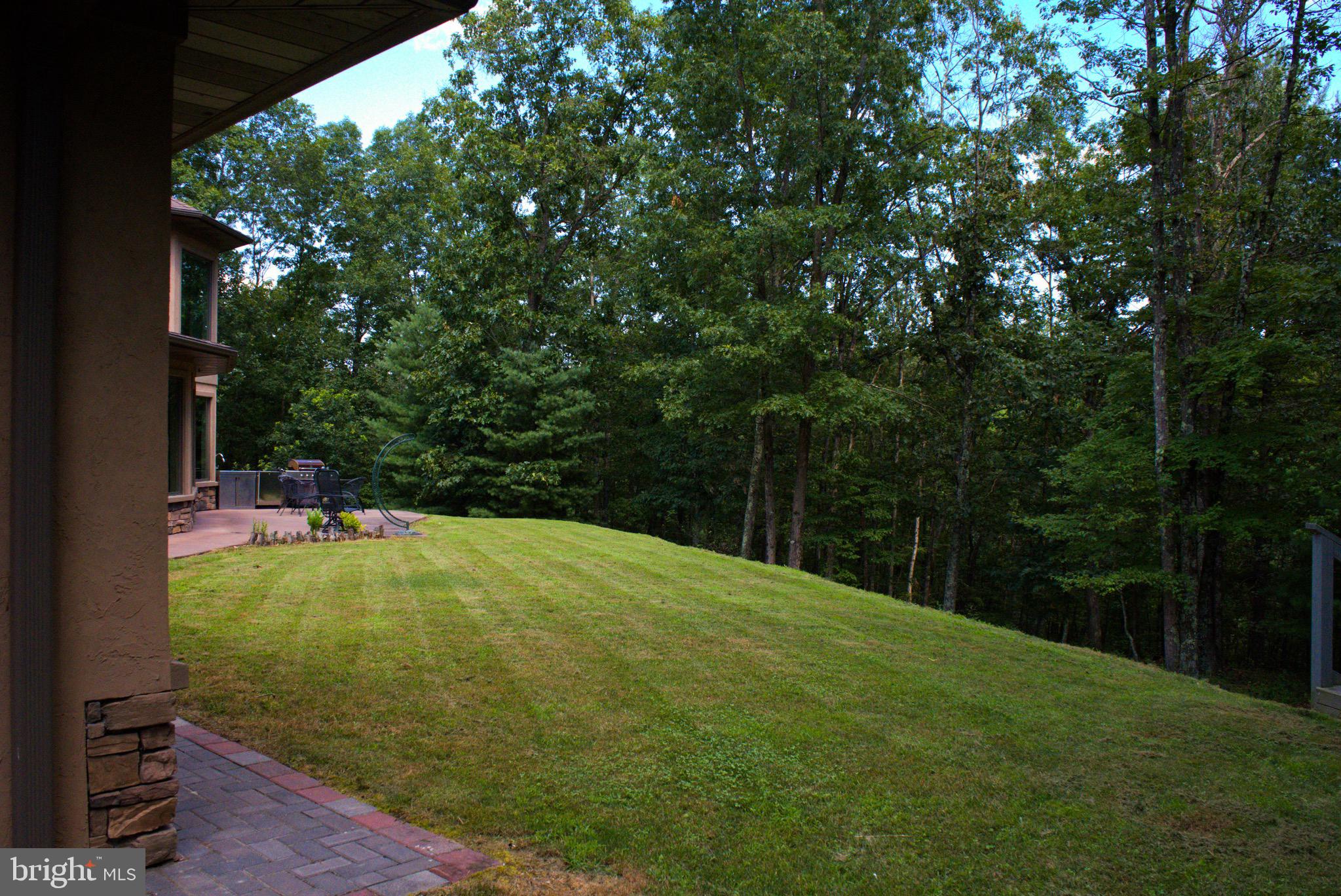 13200 Crossover Road Northeast Flintstone, MD 21530 - Photo 23 of 60 a backyard of a house with yard and trampoline