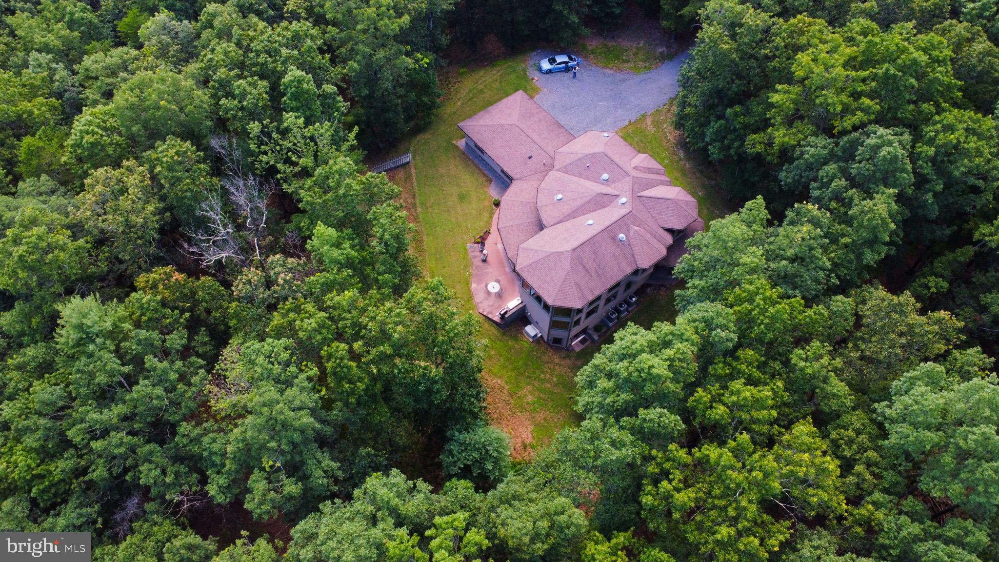 13200 Crossover Road Northeast Flintstone, MD 21530 - Photo 25 of 60 an aerial view of a house with a yard and tennis court