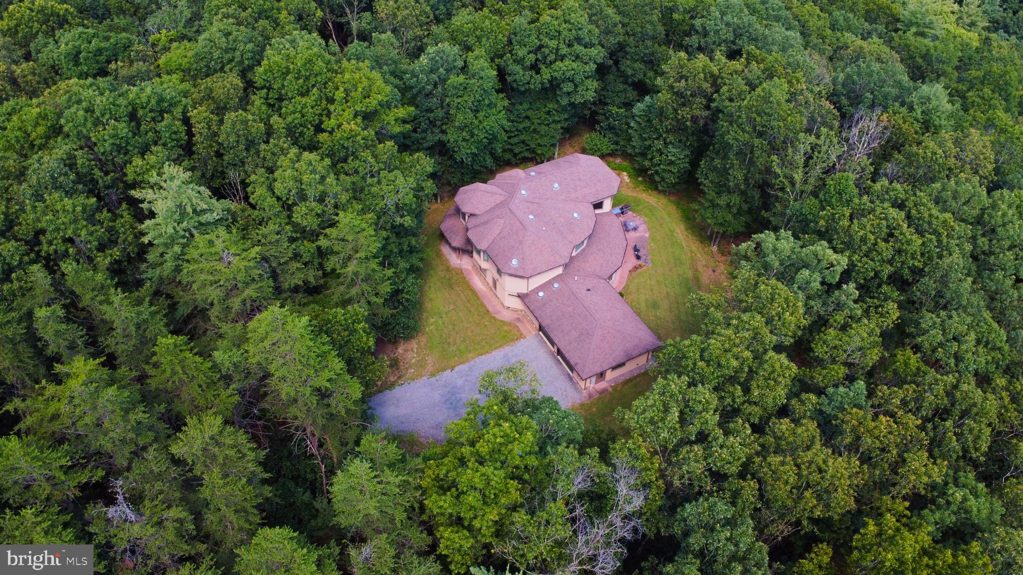 13200 Crossover Road Northeast Flintstone, MD 21530 - Photo 3 of 60 an aerial view of a house with a yard and large trees