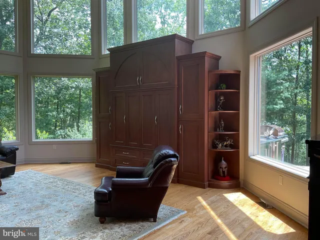 a dining room with furniture and wooden floor