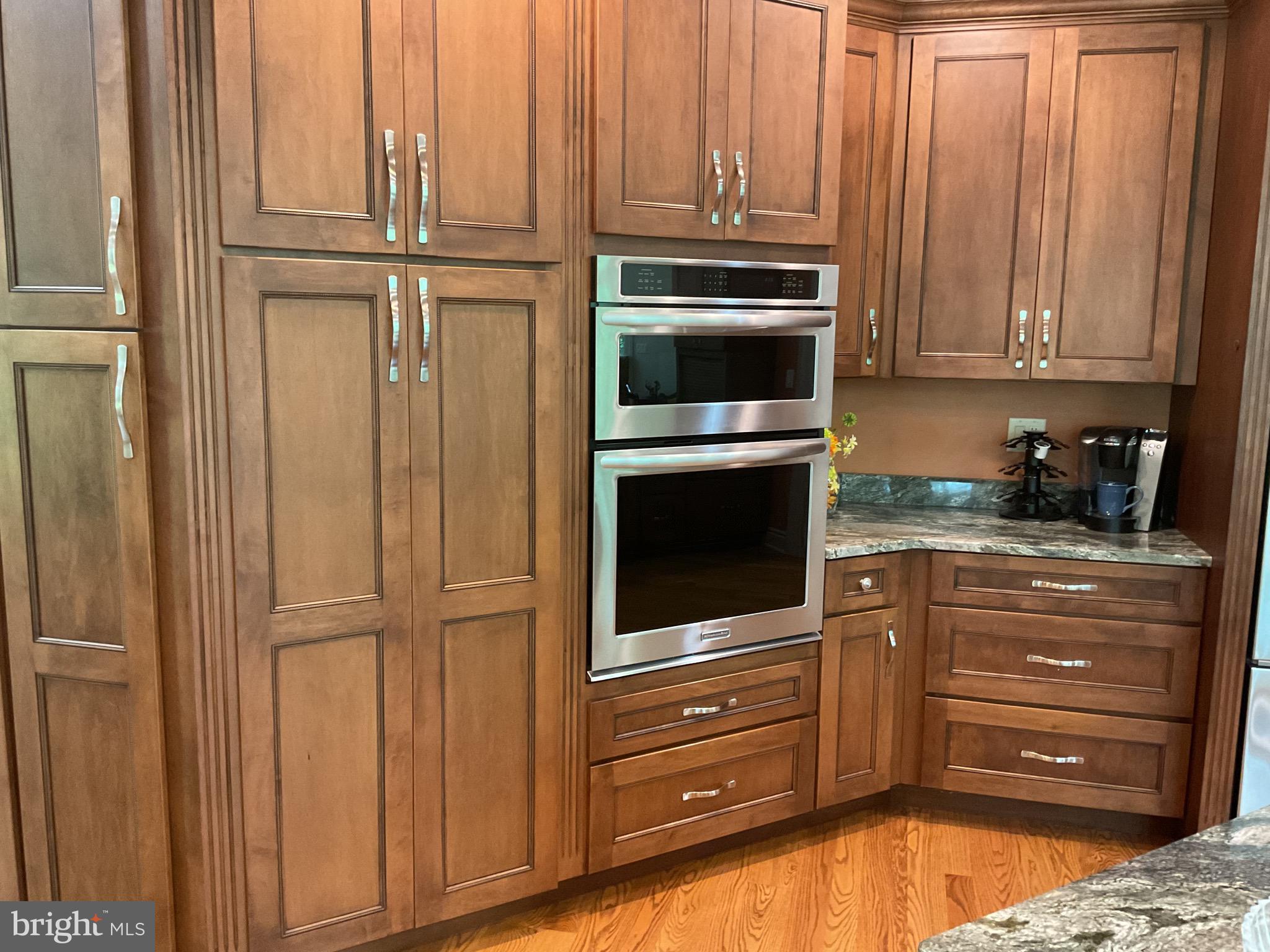 13200 Crossover Road Northeast Flintstone, MD 21530 - Photo 38 of 60 a kitchen with granite countertop wooden cabinets and stainless steel appliances