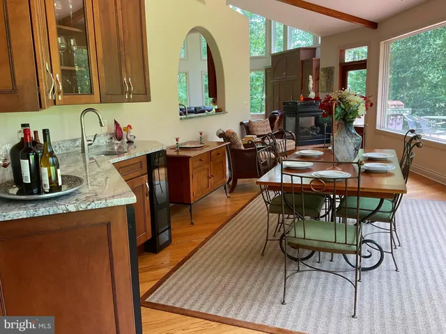 a kitchen with granite countertop wooden cabinets and granite counter tops