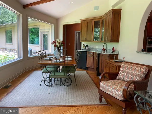 a spacious bathroom with a granite countertop tub sink and mirror
