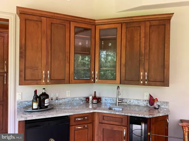 a spacious bathroom with a tub a mirror and sink