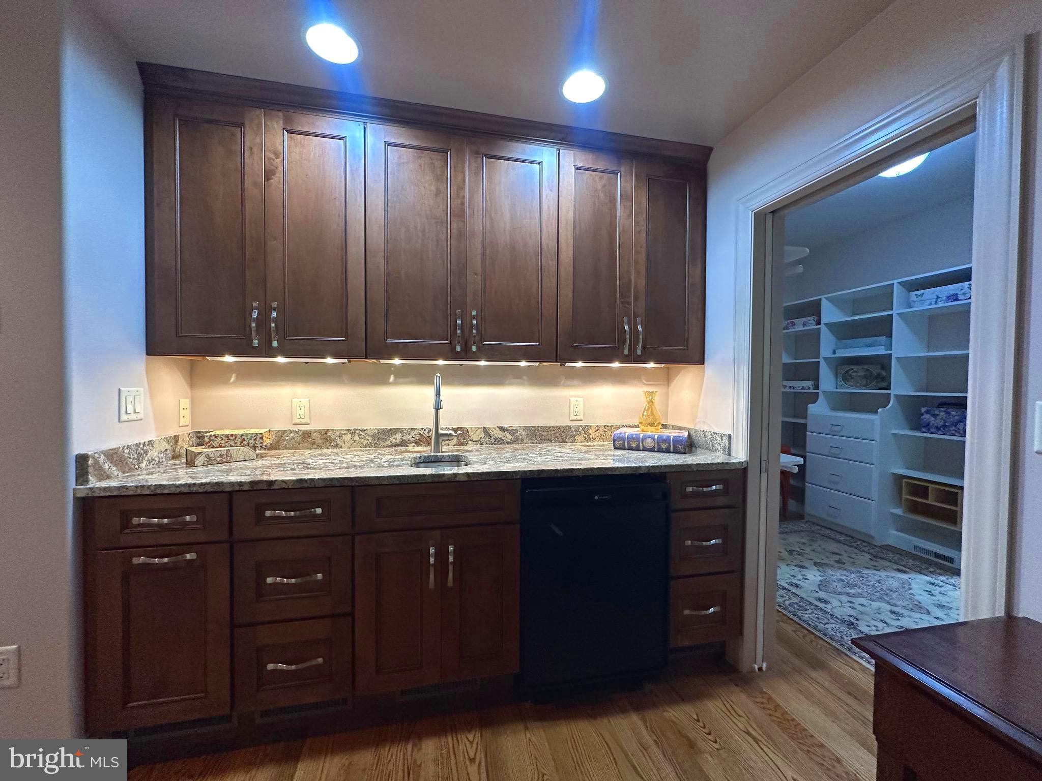 13200 Crossover Road Northeast Flintstone, MD 21530 - Photo 47 of 60 a kitchen with granite countertop wooden cabinets and granite counter tops