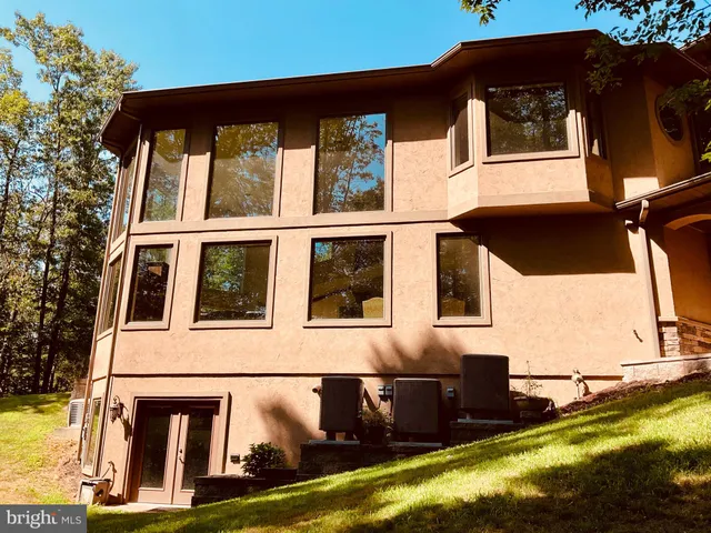 a view of a house with large windows