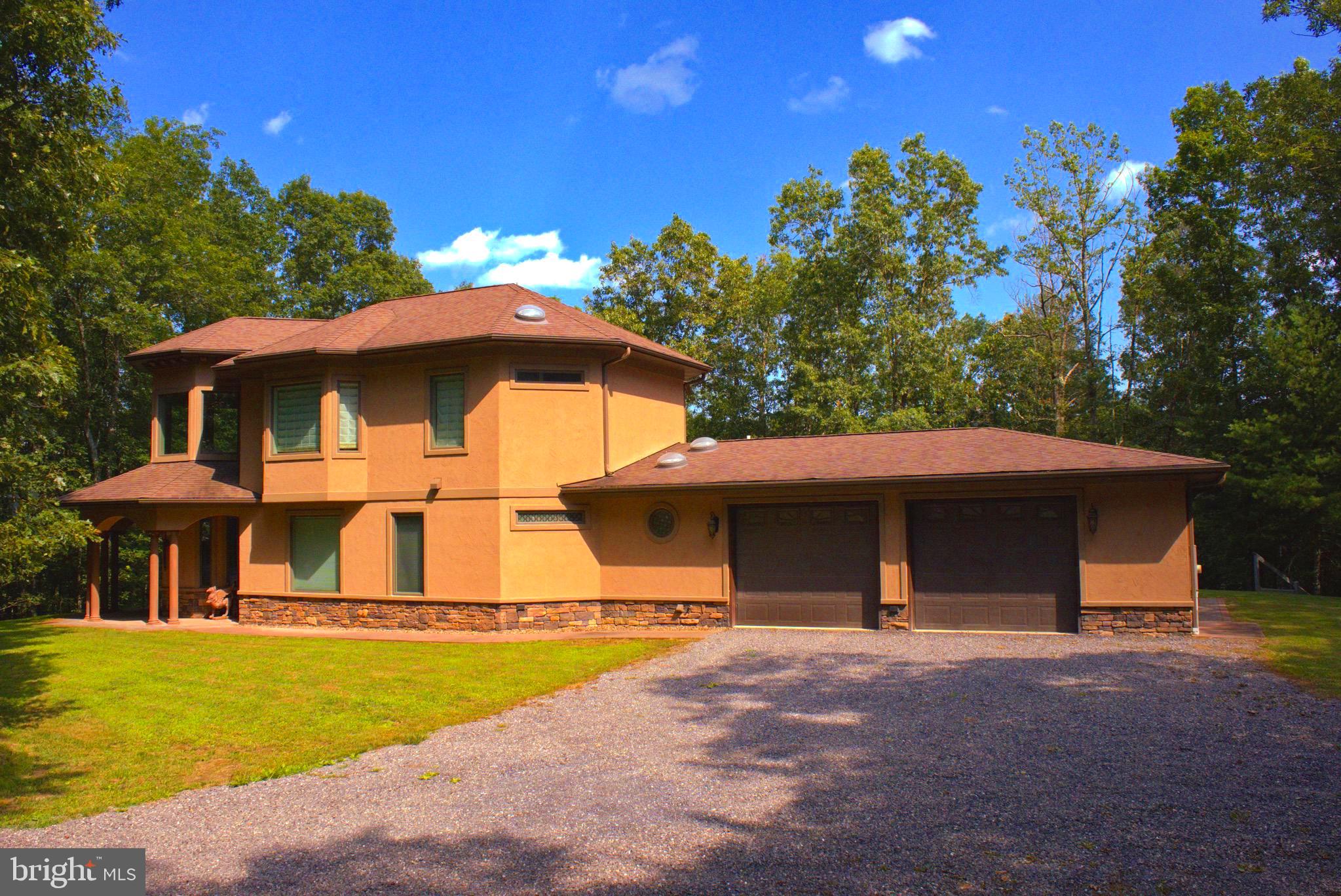 13200 Crossover Road Northeast Flintstone, MD 21530 - Photo 9 of 60 a front view of a house with a yard