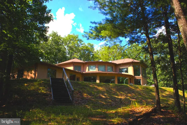 a view of house with outdoor space and porch
