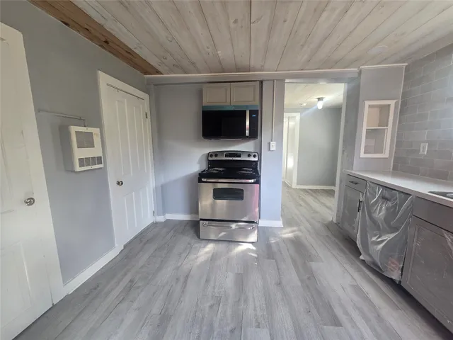 a view of a kitchen from the hallway