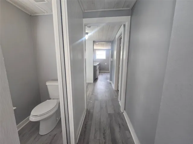 a view of a bathroom from a hallway