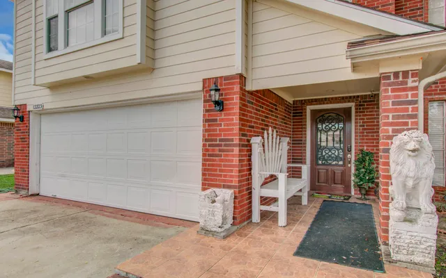 a view of a house with a yard and garage