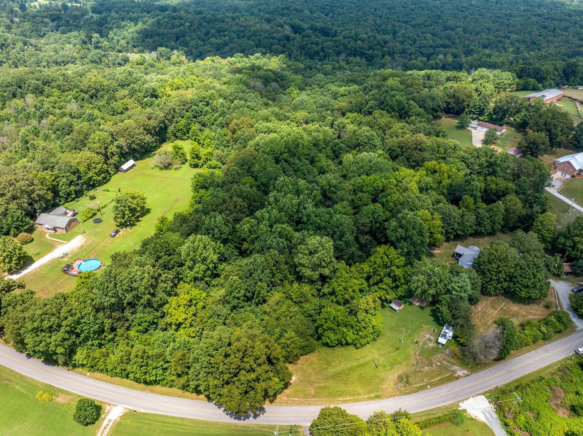 1374 Deal Road Burns, TN 37029 - Photo 2 of 21 a view of a garden with a fountain