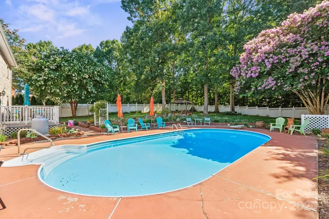 a view of swimming pool with lounge chair