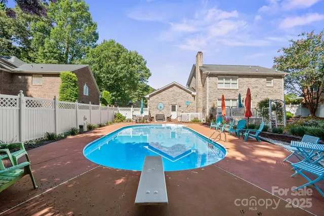 a view of a swimming pool with a patio
