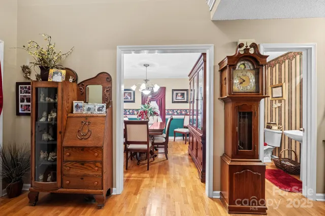 a view of living room with furniture and wooden floor
