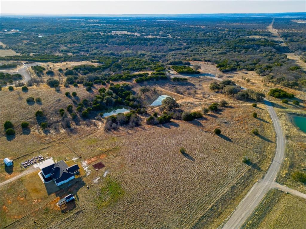 30 Crest Ridge Mineral Wells, TX 76067 - Photo 9 of 10 an aerial view of residential houses with outdoor space