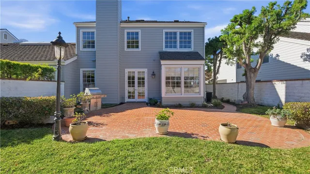 a backyard of a house with yard and outdoor seating
