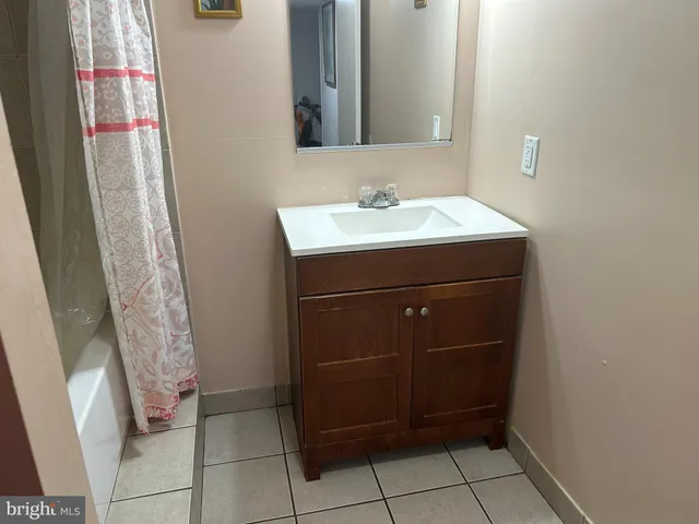 a bathroom with a sink and vanity