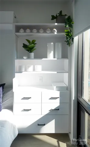 a bathroom with a sink toilet and mirror