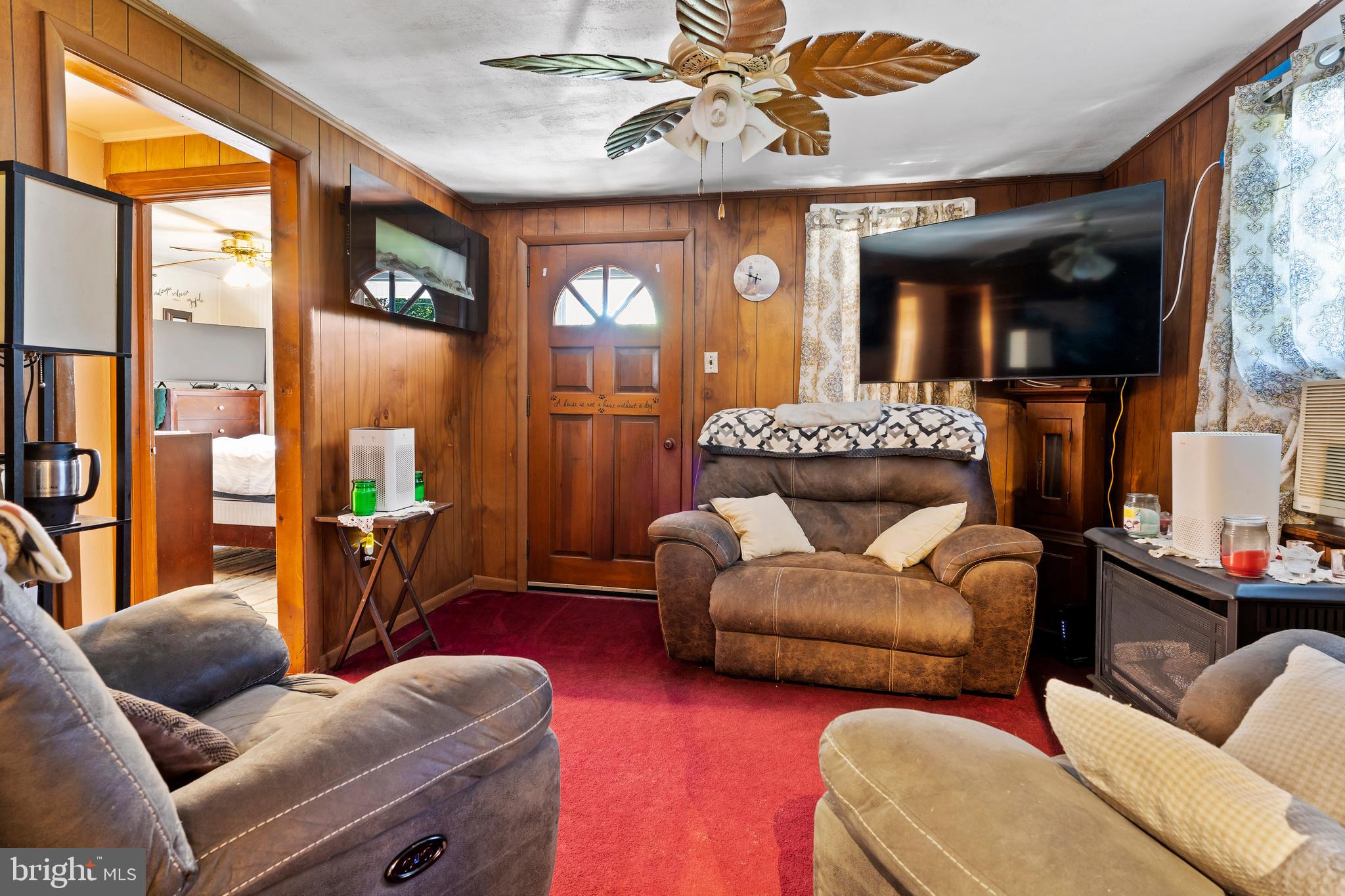 7 Burgners Mill Road Carlisle, PA 17015 - Photo 13 of 26 a living room with furniture and a large window