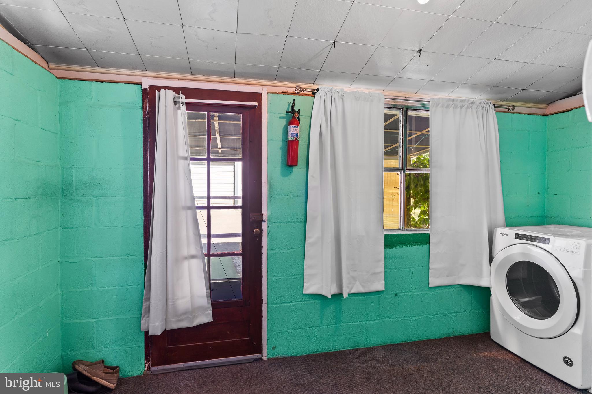 7 Burgners Mill Road Carlisle, PA 17015 - Photo 15 of 26 a view of a hallway with washer and dryer