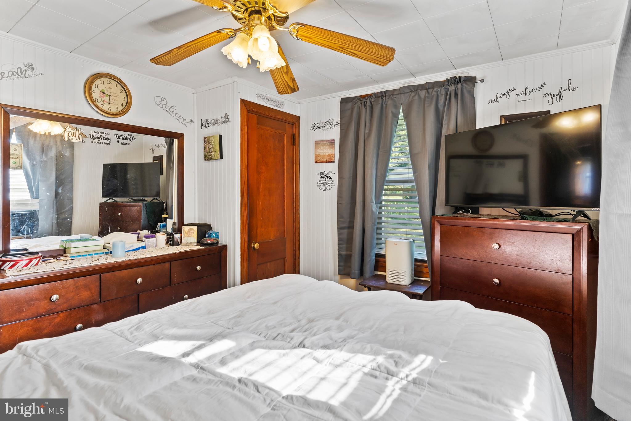 7 Burgners Mill Road Carlisle, PA 17015 - Photo 20 of 26 a bedroom with a bed and a flat tv screen on dresser