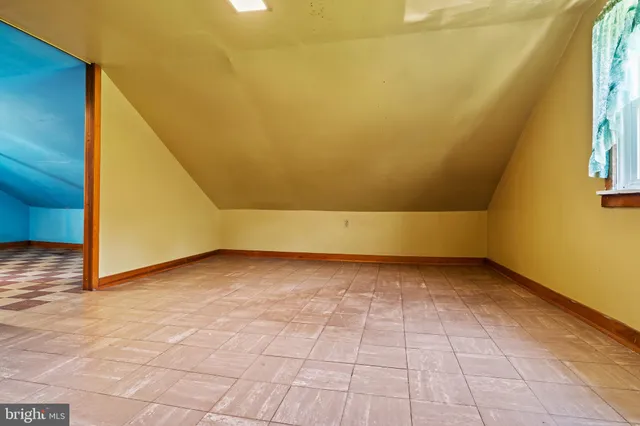 a view of an empty room and window