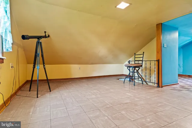 a view of an empty room with stairs