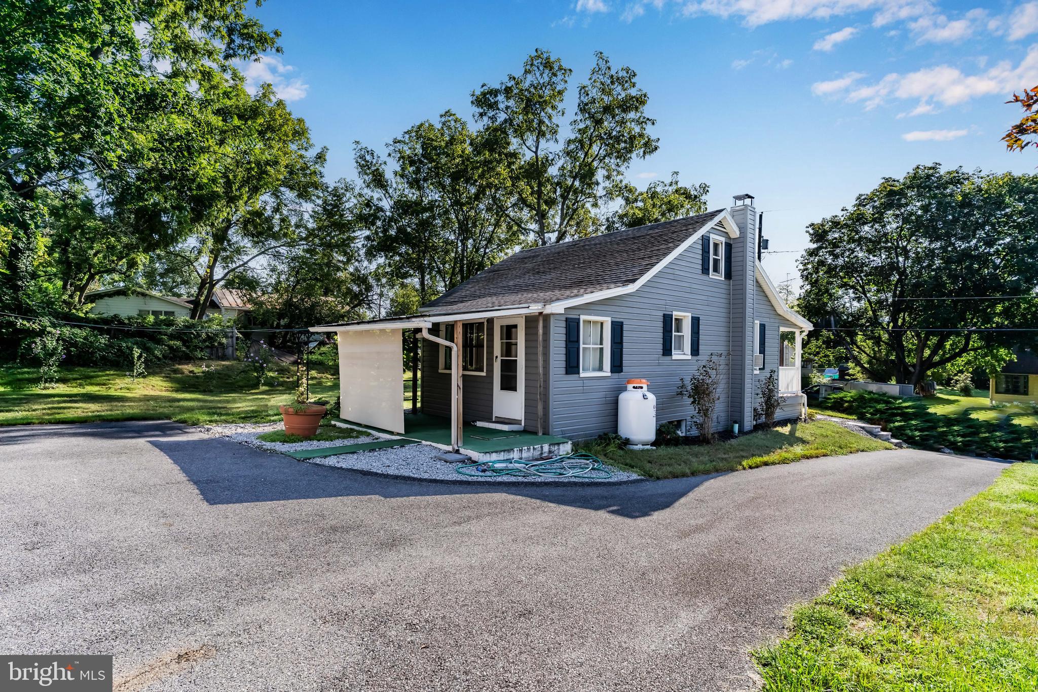 7 Burgners Mill Road Carlisle, PA 17015 - Photo 5 of 26 a view of a house with backyard and trees