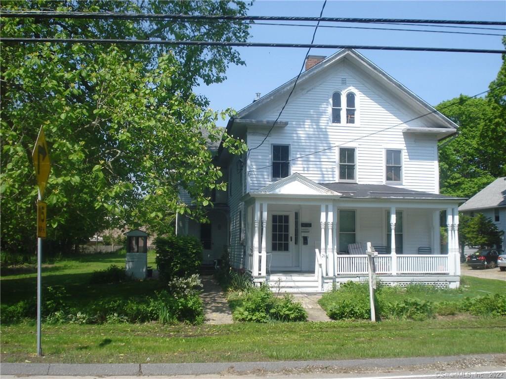 26 High Street Clinton, CT 06413 - Photo 1 of 1 FRONT EXTERIOR VIEW OF THE HOUSE SHOWING THE PORCH AND THE WELL HOUSE TO THE SIDE.