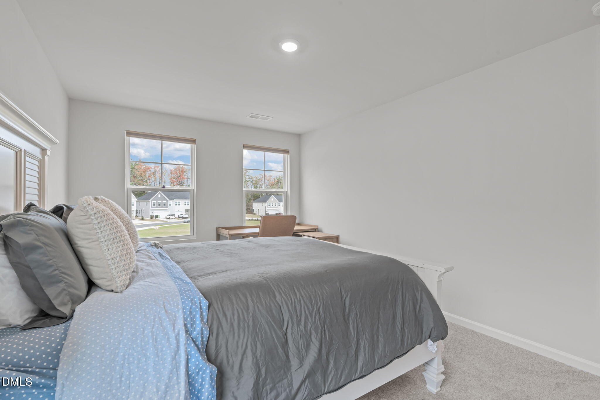 1809 Barrett Run Trail Apex, NC 27502 - Photo 28 of 37 a spacious bedroom with a bed and window