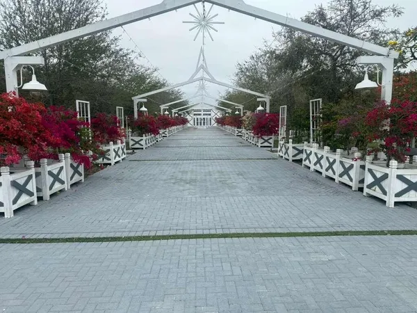 a view of path along with retail shop and buildings