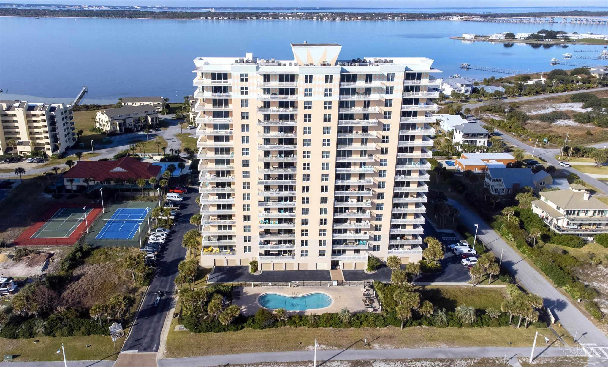 800 Fort Pickens Road, Unit 204 Pensacola Beach, FL 32561 - Photo 39 of 45 a front view of a building with outdoor view and parking