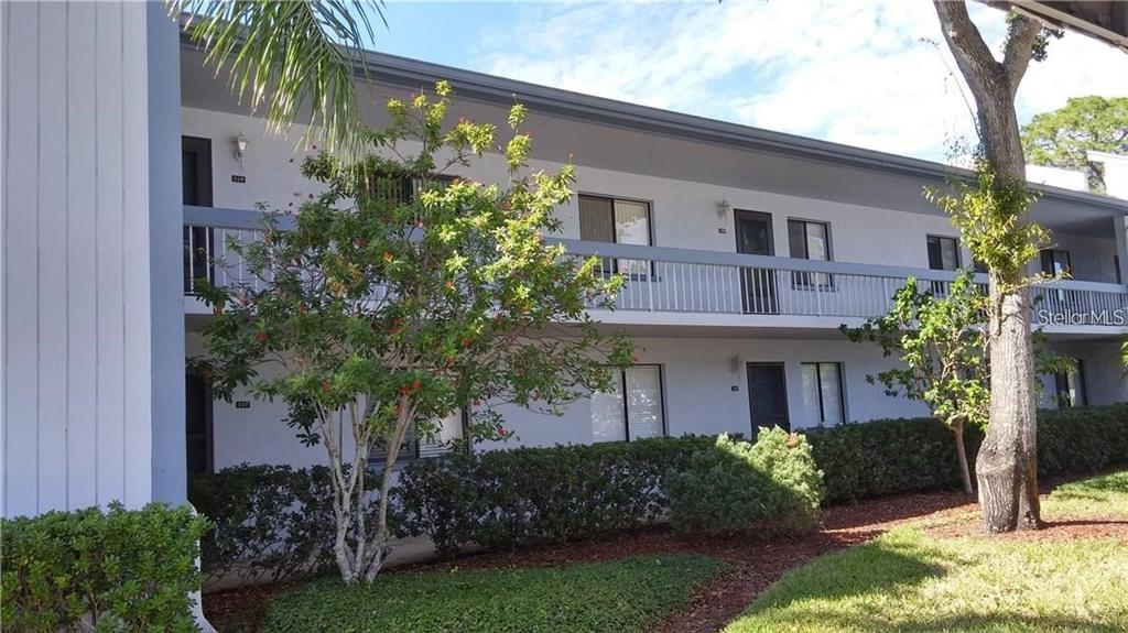 108 Nina Way, Unit 3 Oldsmar, FL 34677 - Photo 1 of 25 a front view of a house with garden