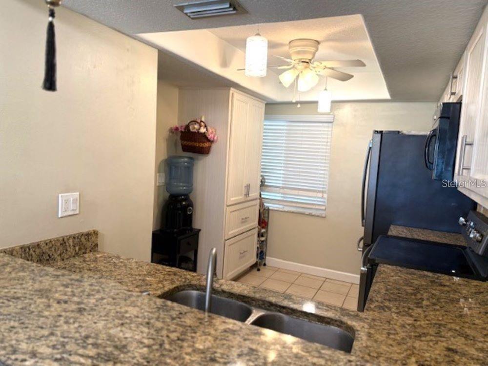 108 Nina Way, Unit 3 Oldsmar, FL 34677 - Photo 18 of 25 a bedroom with a bed and a window
