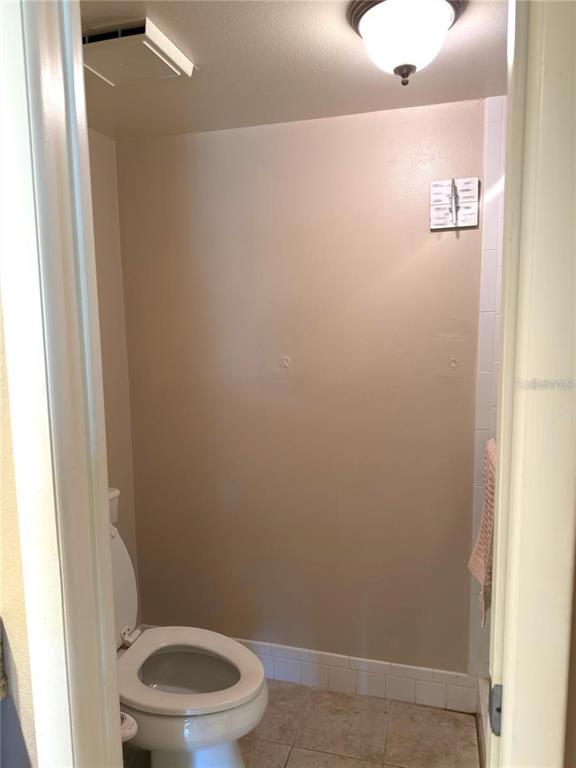108 Nina Way, Unit 3 Oldsmar, FL 34677 - Photo 20 of 25 a white toilet sitting next to a shower