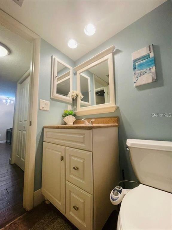 108 Nina Way, Unit 3 Oldsmar, FL 34677 - Photo 22 of 25 a bathroom with a toilet sink and mirror