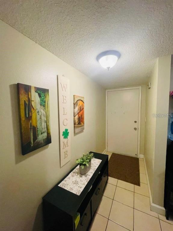 108 Nina Way, Unit 3 Oldsmar, FL 34677 - Photo 24 of 25 a living room with couch and baby