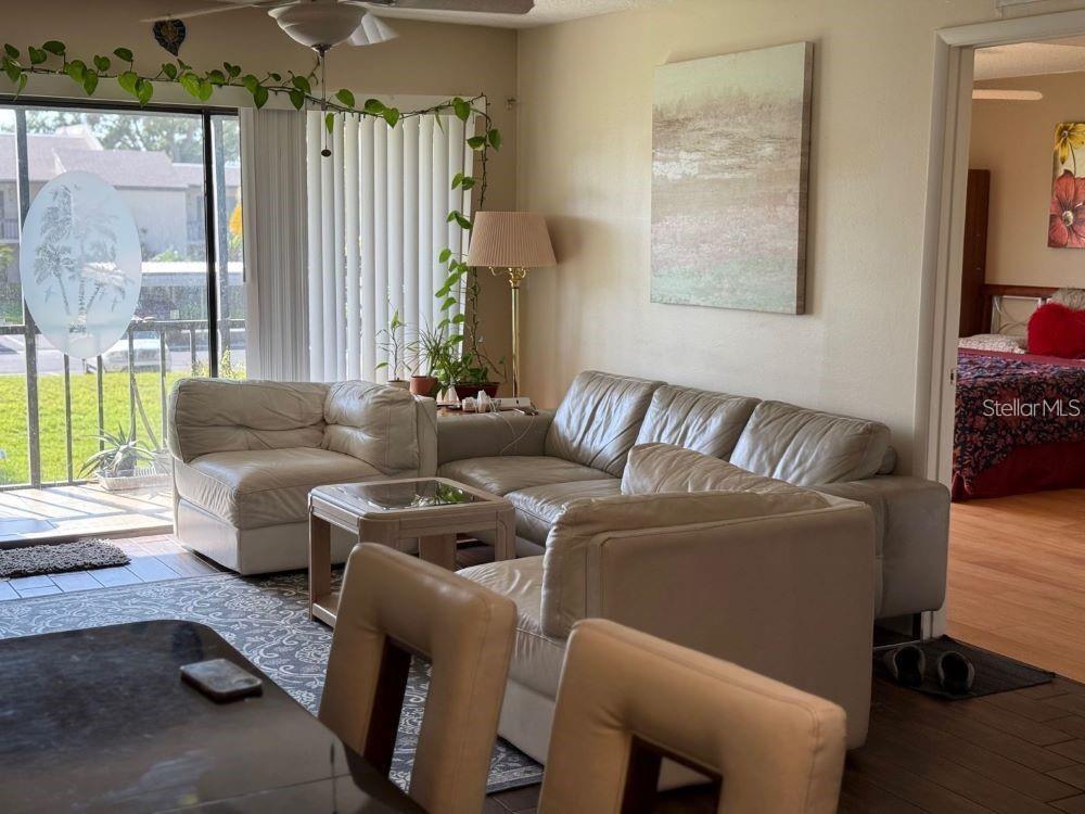 108 Nina Way, Unit 3 Oldsmar, FL 34677 - Photo 8 of 25 a living room with furniture and a large window