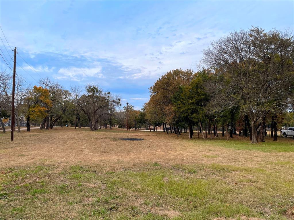 3101 Collins Road Burleson, TX 76028 - Photo 2 of 10 a view of a field with trees in the background