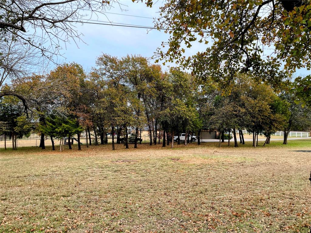 3101 Collins Road Burleson, TX 76028 - Photo 6 of 10 a front view of a building with trees