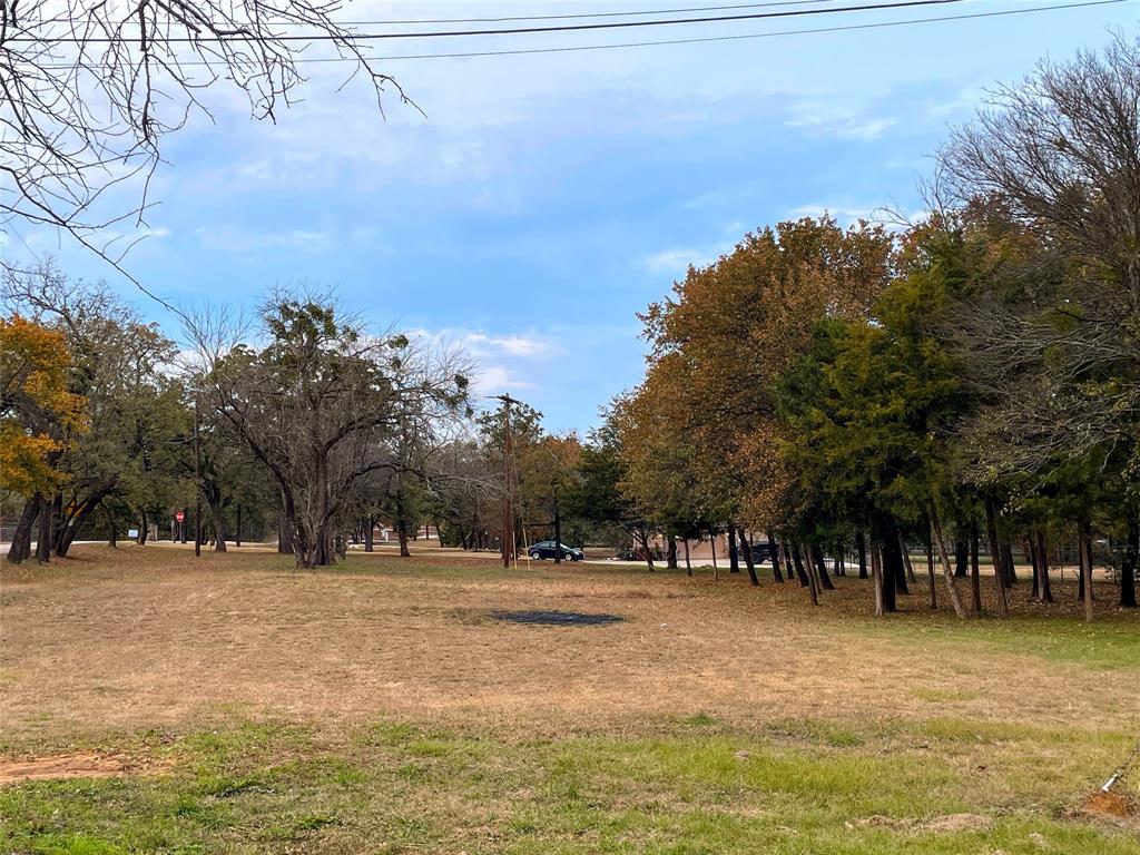 3101 Collins Road Burleson, TX 76028 - Photo 9 of 10 a view of swimming pool with outdoor seating and trees in the background