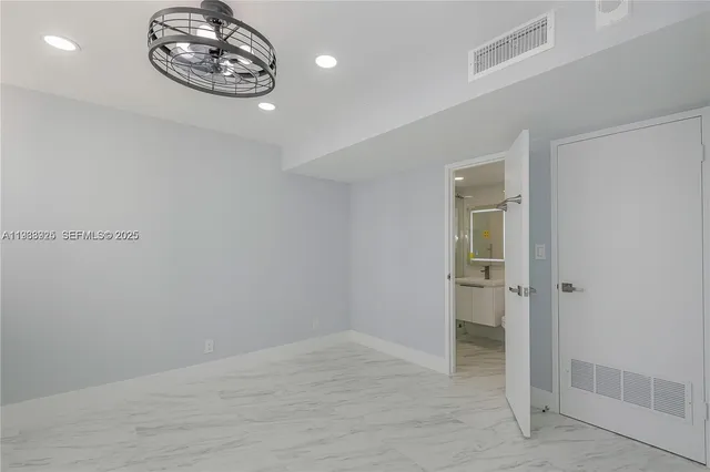 a view of a room with a large window