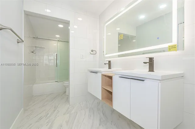 a bathroom with a toilet and shower